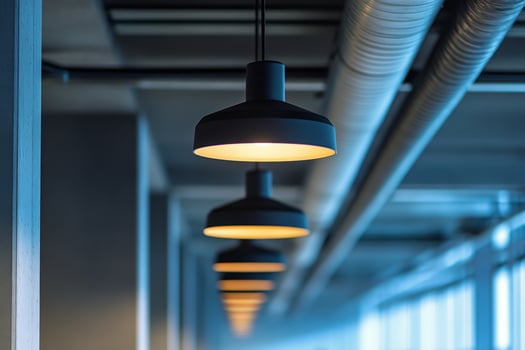 A long row of lights in a hallway photo
