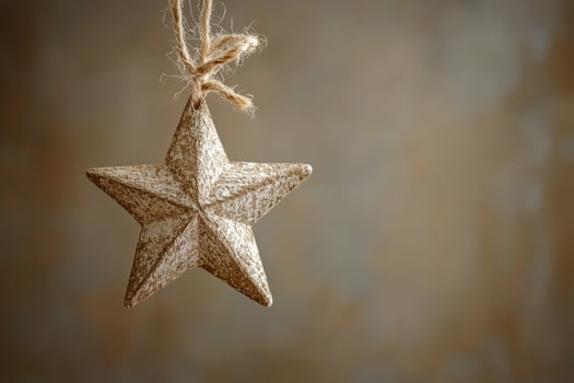 Hanging decorative star ornament against a rustic background in soft light photo
