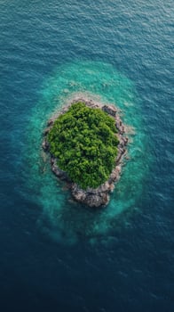 Lush green island surrounded by clear blue ocean waters in daylight photo