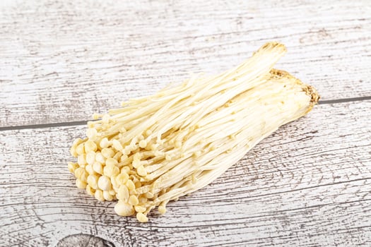 Tasty raw enoki mushroom heap photo