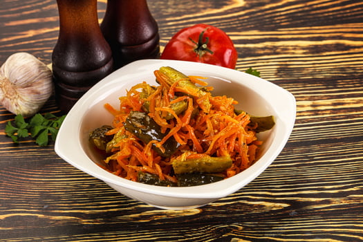 Salad with korean carrot and cucumber photo