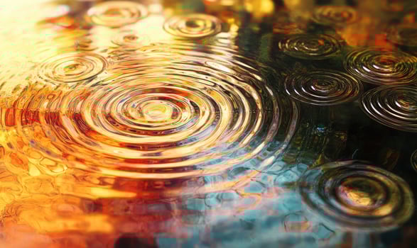 A series of raindrops on a surface photo