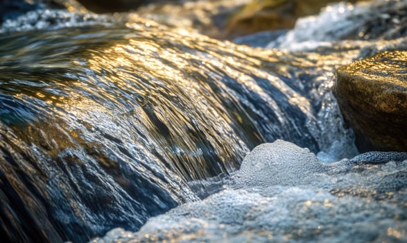 A stream of water with foam on top photo