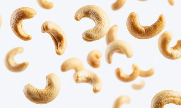 cashew nuts falling in the air photo
