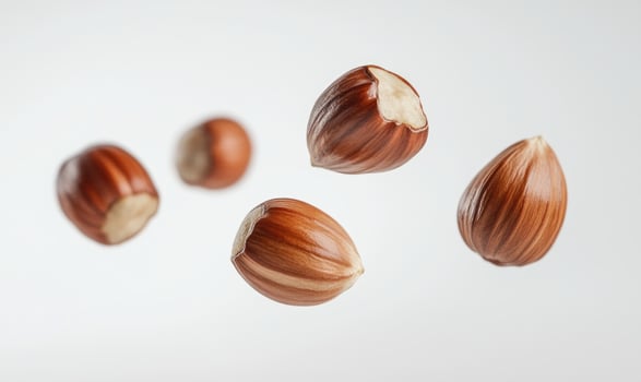Photo of nuts are shown in the air