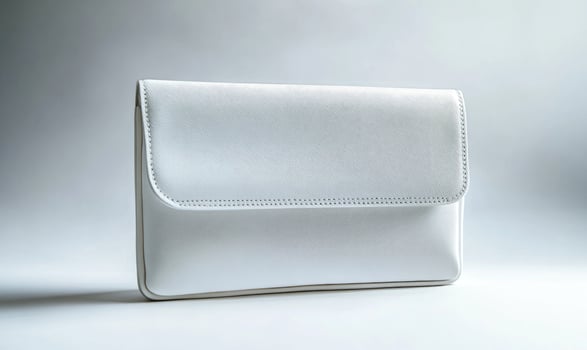 A white purse with a white pattern on it photo