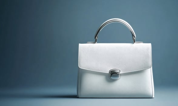 A white purse with a silver handle photo
