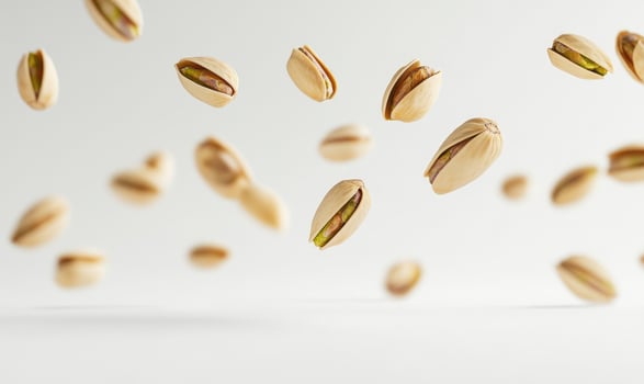 A bunch of peanuts are flying through the air photo