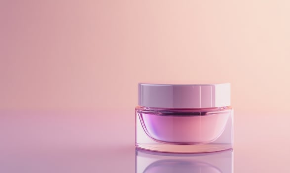 A clear jar of cream is sitting on a pink background photo