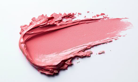 a pink lipstick is shown on a white surface, lipsticks stroke on white photo