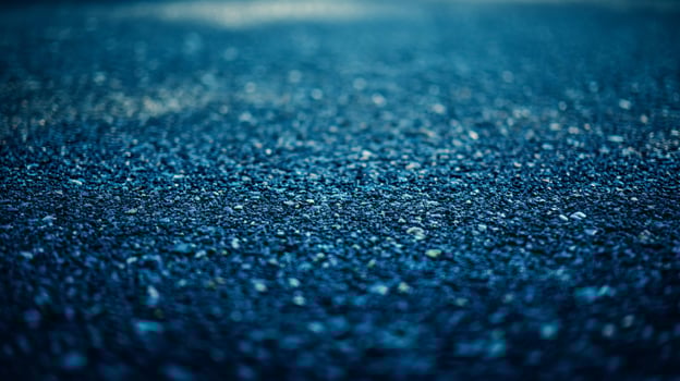 A blue background with a lot of small rocks photo