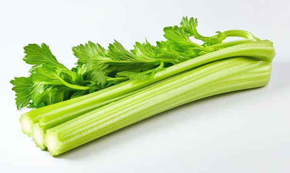 A bunch of celery with green leaves, side view photo
