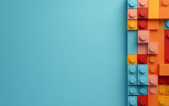 Colorful building blocks arranged creatively on a blue background showcasing creativity and imagination photo