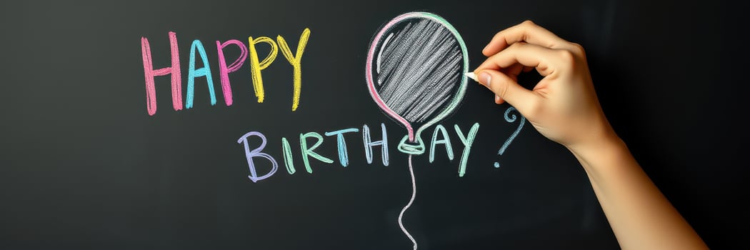 Creative birthday greeting displayed on a chalkboard with colorful chalk art and balloons photo