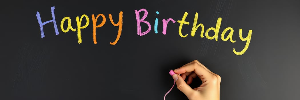 Colorful chalk lettering creates a cheerful happy birthday message on a blackboard in a festive celebration setting photo