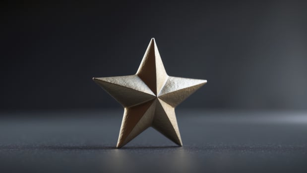 a close up of a gold star on a black background photo