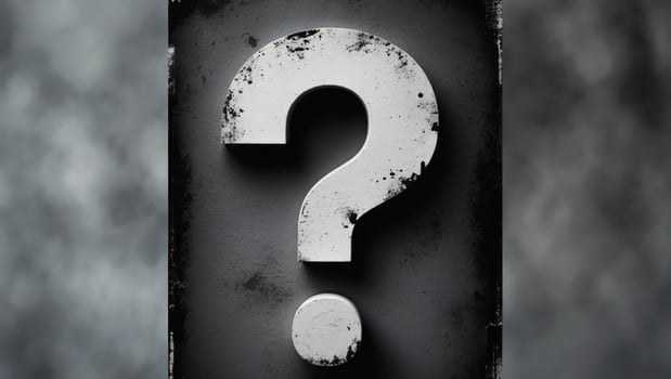 A question mark is shown on a black background photo