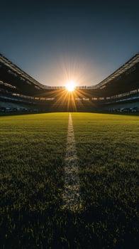 Sunrise illuminating a sports field with shadows and seating in the early morning hours photo
