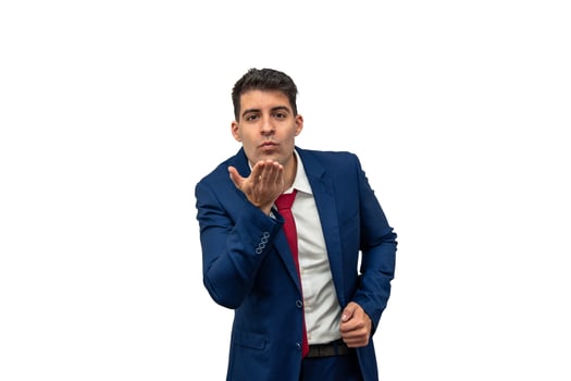 Suited Businessman Blowing Kiss with Blue Suit and Red Tie white background photo