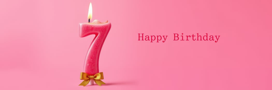 Birthday celebration for a child featuring a pink number candle and cheerful decorations for a seventh birthday photo