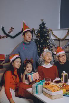 Asian family celebrating christmas together photo