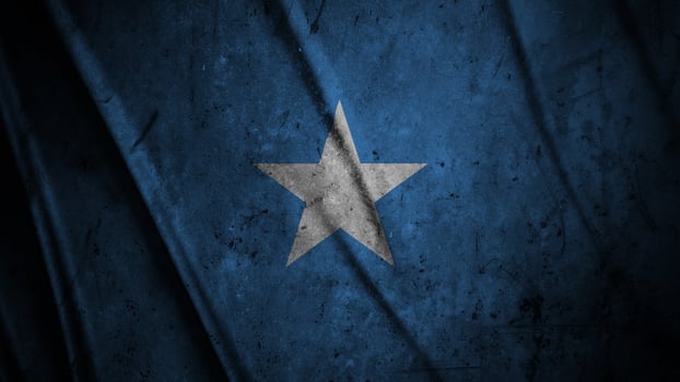Somalia grunge silk flag waving in the wind background illustration, grunge textured flag on silk photo