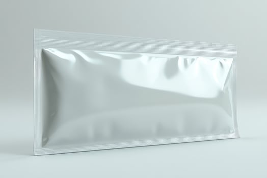 Blank white realistic plastic sachet pack lying on white background photo