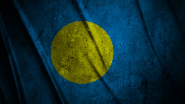 Palau grunge silk flag waving in the wind background illustration, grunge textured flag on silk photo