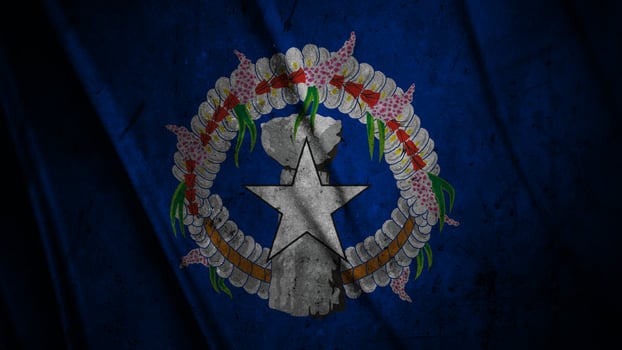 Norrn Mariana Islands grunge silk flag waving in the wind background illustration, grunge textured flag on silk photo