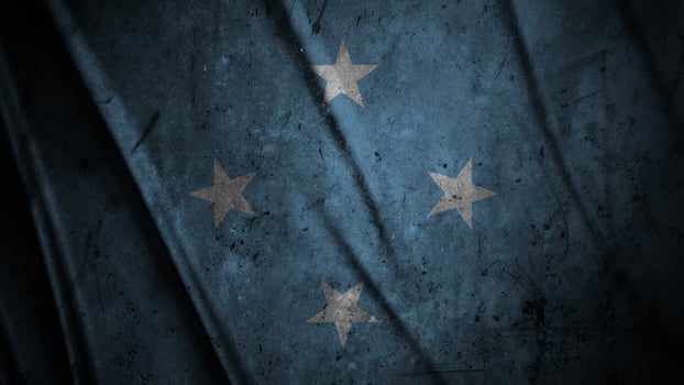 Micronesia grunge silk flag waving in the wind background illustration, grunge textured flag on silk photo