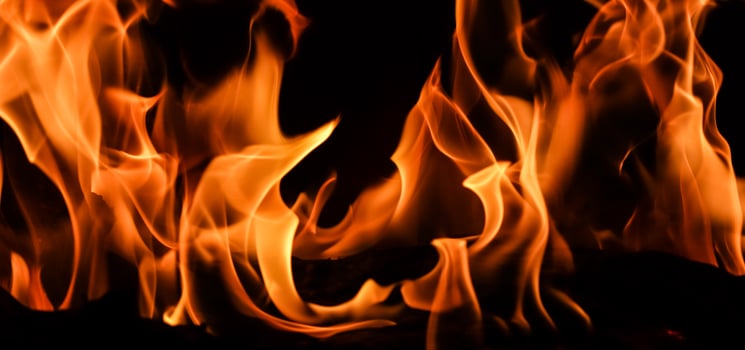 Flames of fire on a black background. The mystery of fire. photo