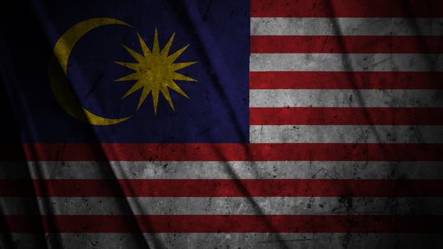 Malaysia grunge silk flag waving in the wind background illustration, grunge textured flag on silk photo