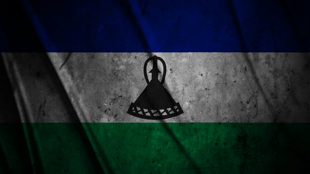 Lesotho grunge silk flag waving in the wind background illustration, grunge textured flag on silk photo