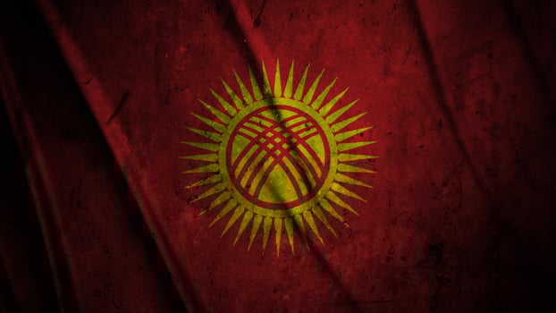 Kyrgyzstan grunge silk flag waving in the wind background illustration, grunge textured flag on silk photo
