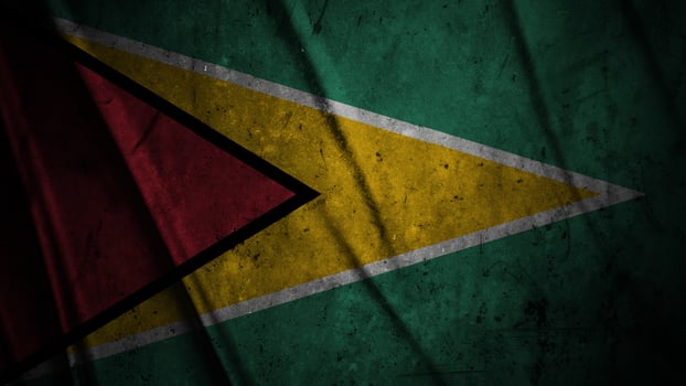 Guyana grunge silk flag waving in the wind background illustration, grunge textured flag on silk photo