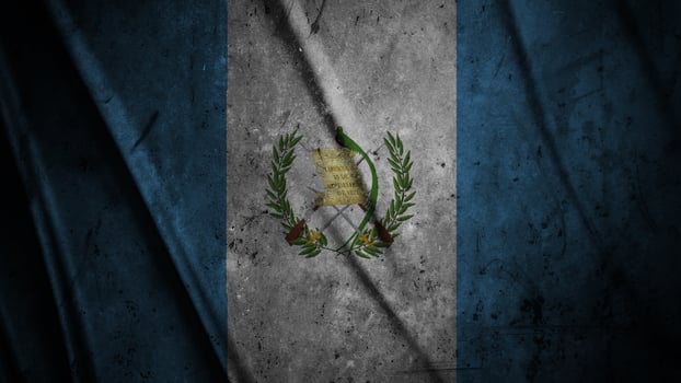 Guatemala grunge silk flag waving in the wind background illustration, grunge textured flag on silk photo