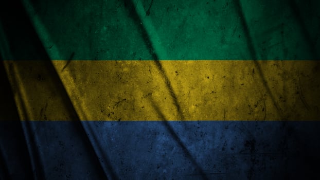 Gabon grunge silk flag waving in the wind background illustration, grunge textured flag on silk photo