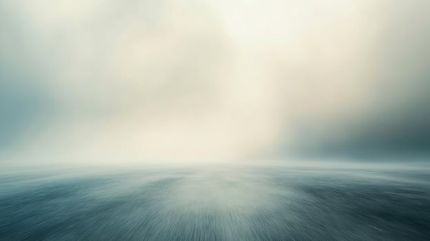 A cloudy sky with a large body of water in the background photo