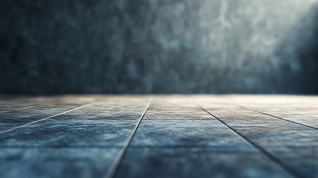 A grey and white tile floor with a few tiles missing photo