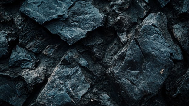 A close up of a rock wall with a dark blue color photo