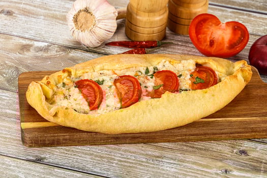 Turkish Pide with cheese and tomato photo