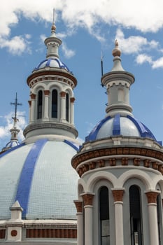 vertical closeup Blue domes of the Cathedral of the Immaculate Conception in Cuenca, Ecuador photo