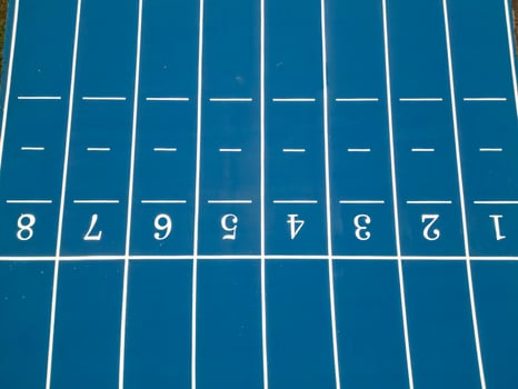 Aerial Drone View of Blue Athletic Track Start Line photo