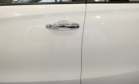 Handle of a silver car door photo