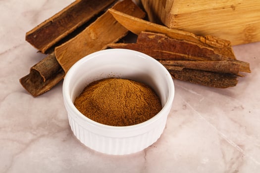 Natural Cinnamon powder with sticks photo