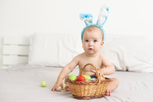 Newborn baby girl in a rabbit ears. Easter Holiday photo