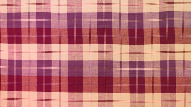 A checkered cloth with a purple and white pattern photo