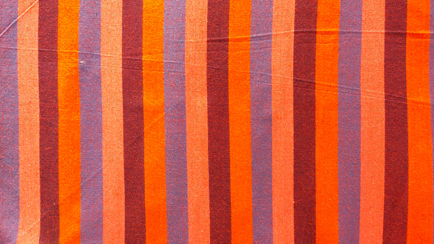 A striped orange and purple fabric photo