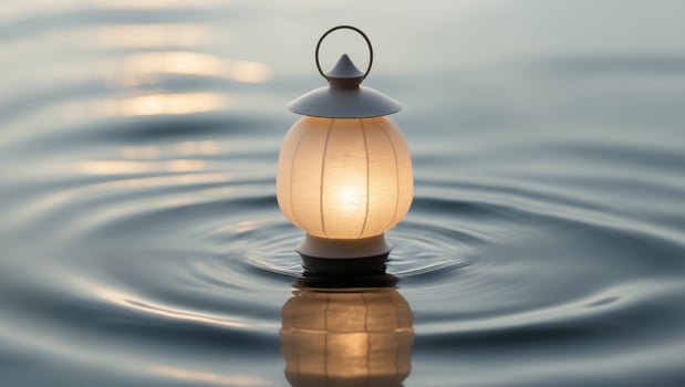 Tranquil Lantern in Serene Water Reflection photo