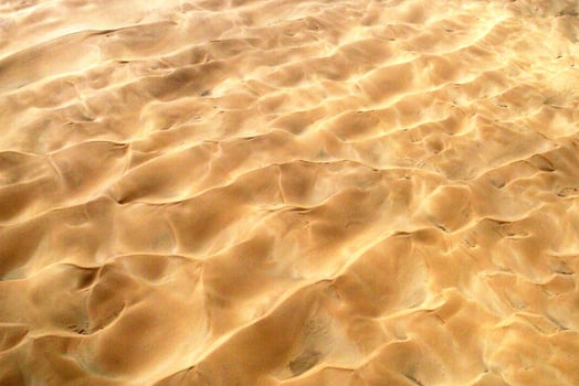 Aesthetic desert surrounded by bright golden orange photo